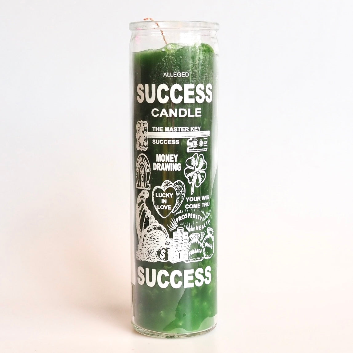 'Success' Vela 7 Day Prayer Candle by Santa Sabina glass screen-printed pillar holder in green wax. UK