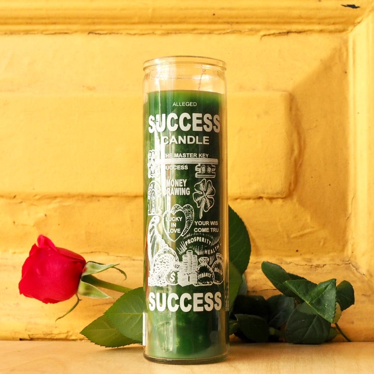 'Success' Vela 7 Day Prayer Candle by Santa Sabina glass screen-printed pillar holder in green wax. UK